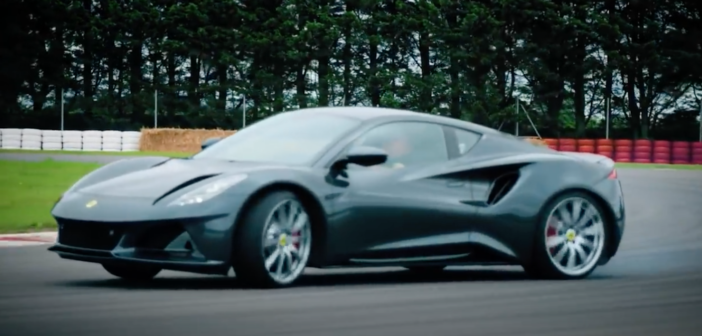A V6 First Edition Lotus Emira being driven sideways on a racetrack