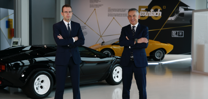 Rouven Mohr and Maurizio Reggiani standing in front of a classic lamborghini countach