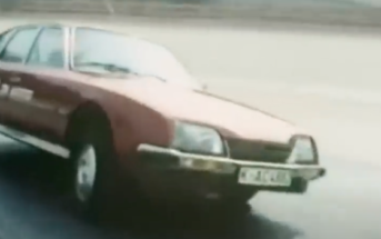 a classic Citroen cornering hard with suspension lean -