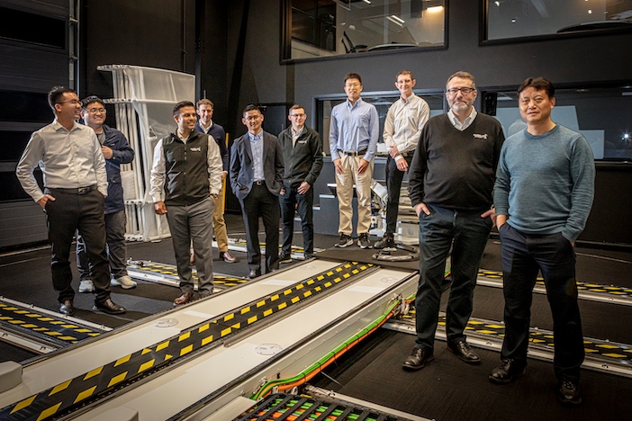 Team members from the two companies assembled at Ansible Motion’s R&D centre in Hethel