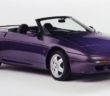 A purple lotus elan s2 with the roof down