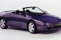 A purple lotus elan s2 with the roof down