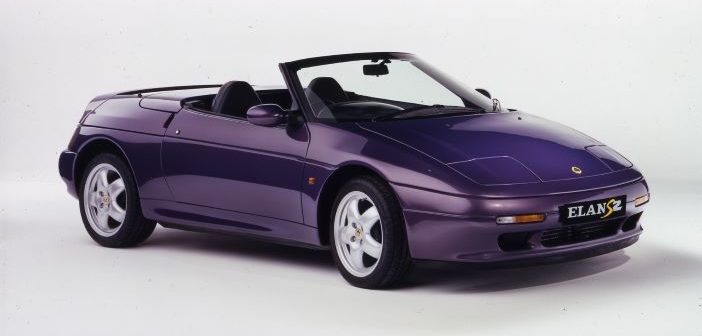 A purple lotus elan s2 with the roof down